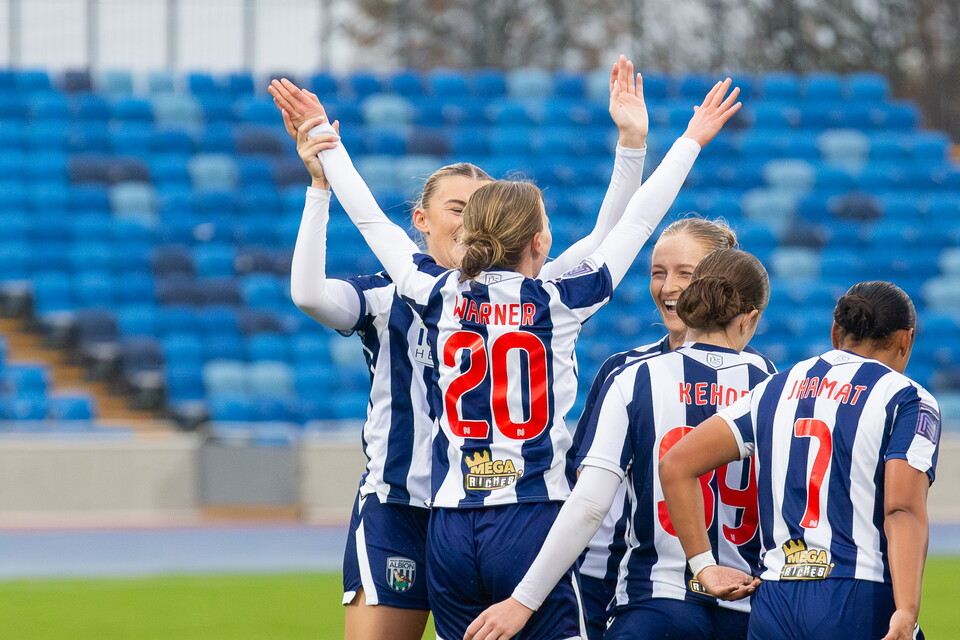 Phoebe Warner celebrates at the Alexander Stadium.