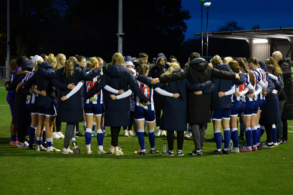 WBA Women in a team huddle after a game