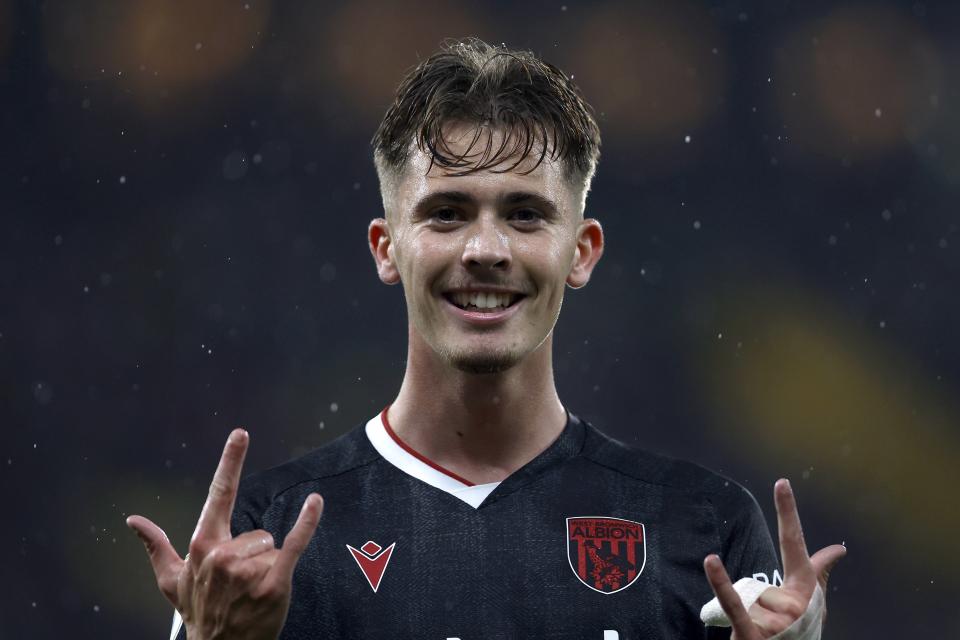 A photo of Isaac Price celebrating his goal.