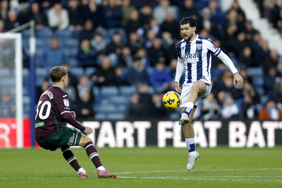 A photo of Alex Mowatt playing against Swansea City. 