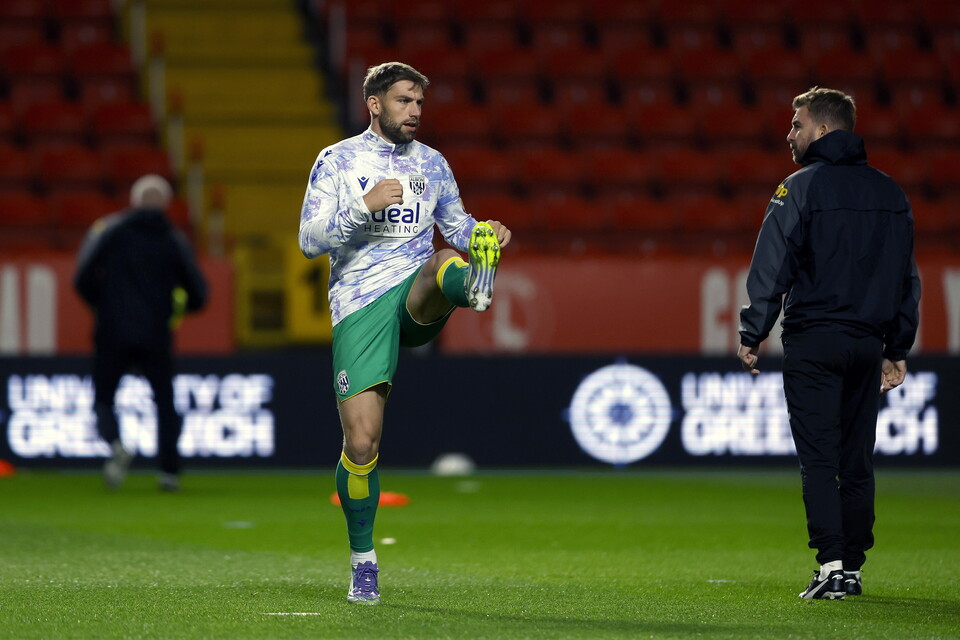 A photo of Charlie Taylor warming up 