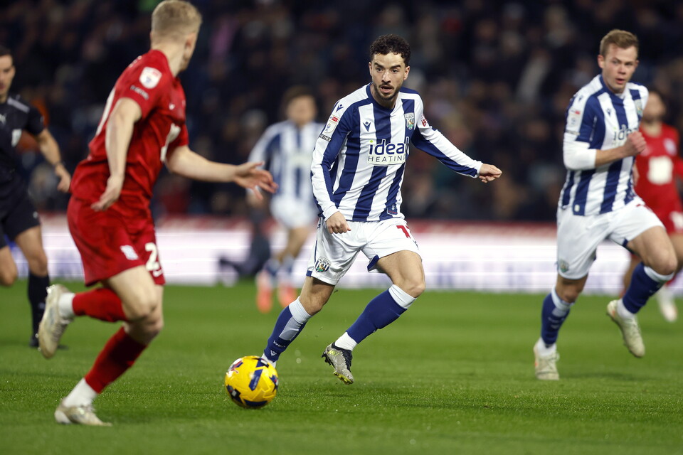 A photo of Mikey Johnston against Blues. 