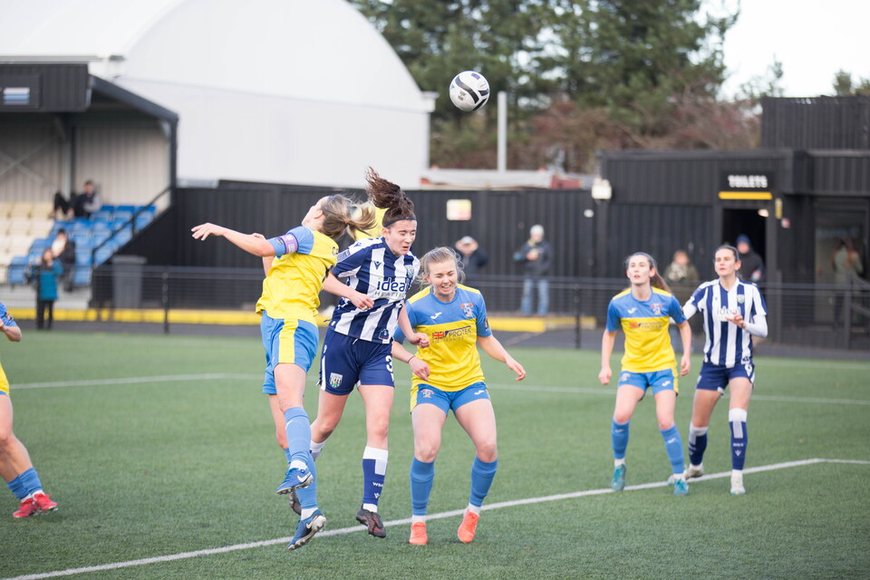 Lucy Day heads goalwards against Sporting Khalsa.