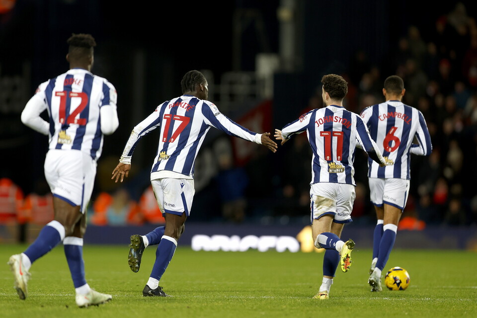 Ousmane Diakite high-fives Mikey Johnston.