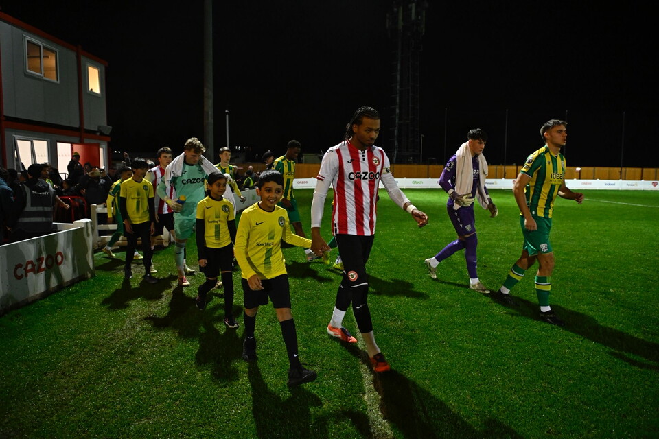 Albion walk out alongside Brentford (Photo: Pro Sports Images)