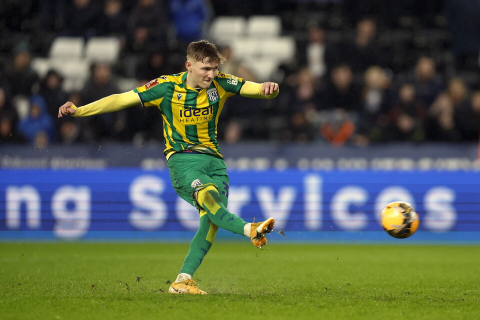 Ollie Bostock scores his penalty.