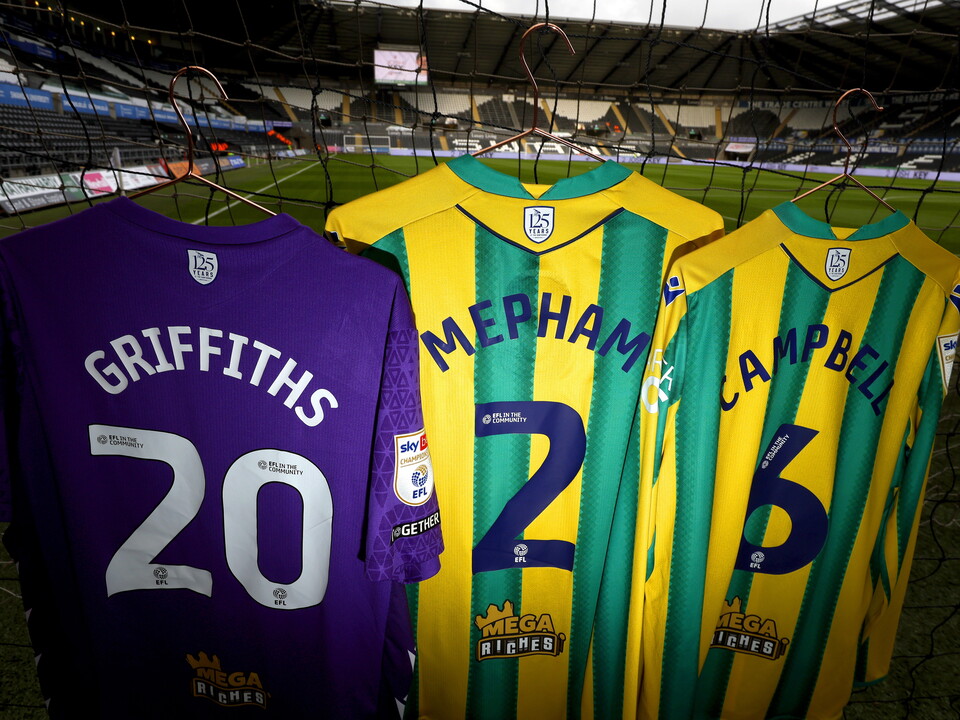 An image of Albion's green and yellow shirts with the numbers '2026' on them at the Swansea.com Stadium