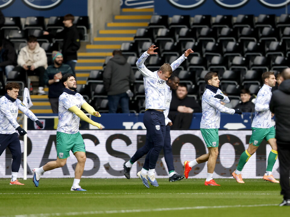 An image of the Albion squad warming up before their match against Swansea