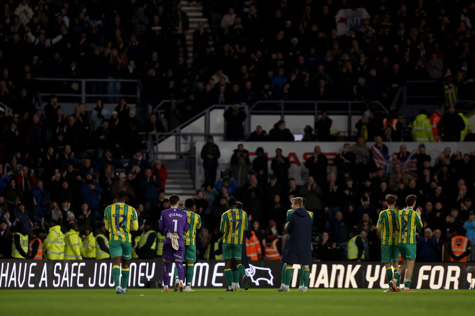 The squad applaud the away end at full-time.