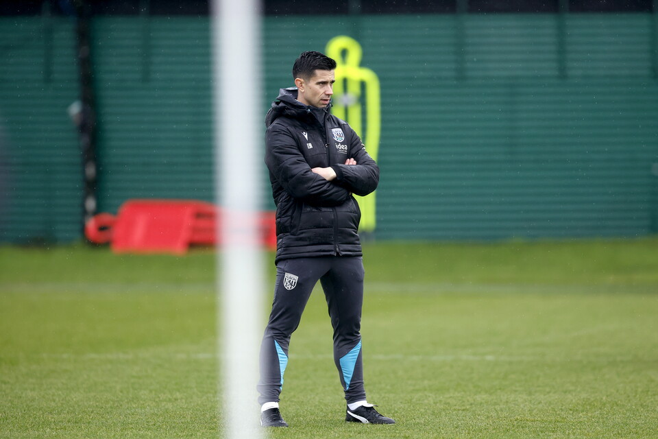 Eric Ramsay watching training in the rain