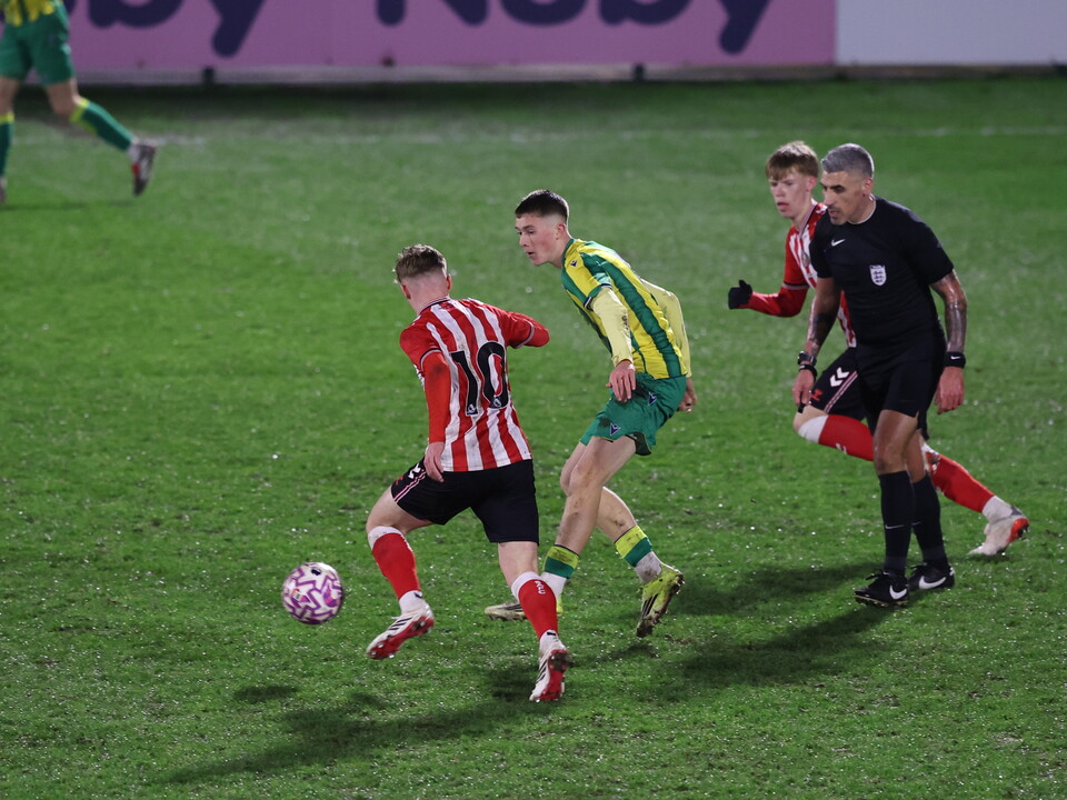 A photo of Albion U18 player Ryan Colesby in the 2025/26 green and yellow away kit
