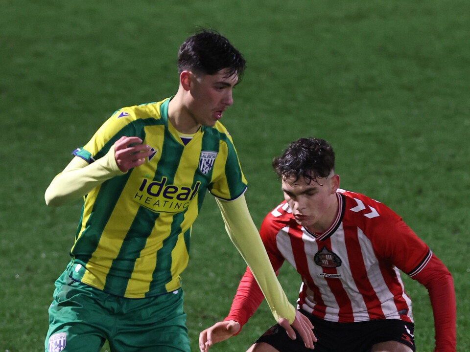 A photo of Albion U18 player Rio Parmar in the 2025/26 green and yellow away kit