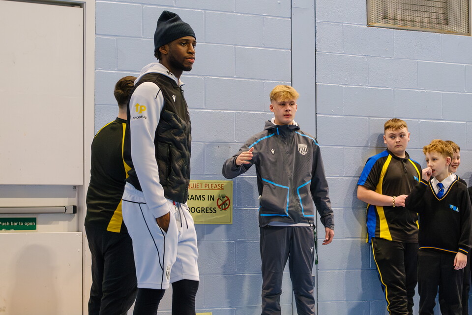Samuel Lling Junior taking part in an activity with pupils