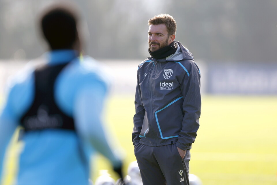 James Morrison smiling while watching a training session