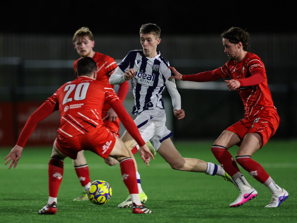 An image of Ryan Colesby on the ball against Redditch