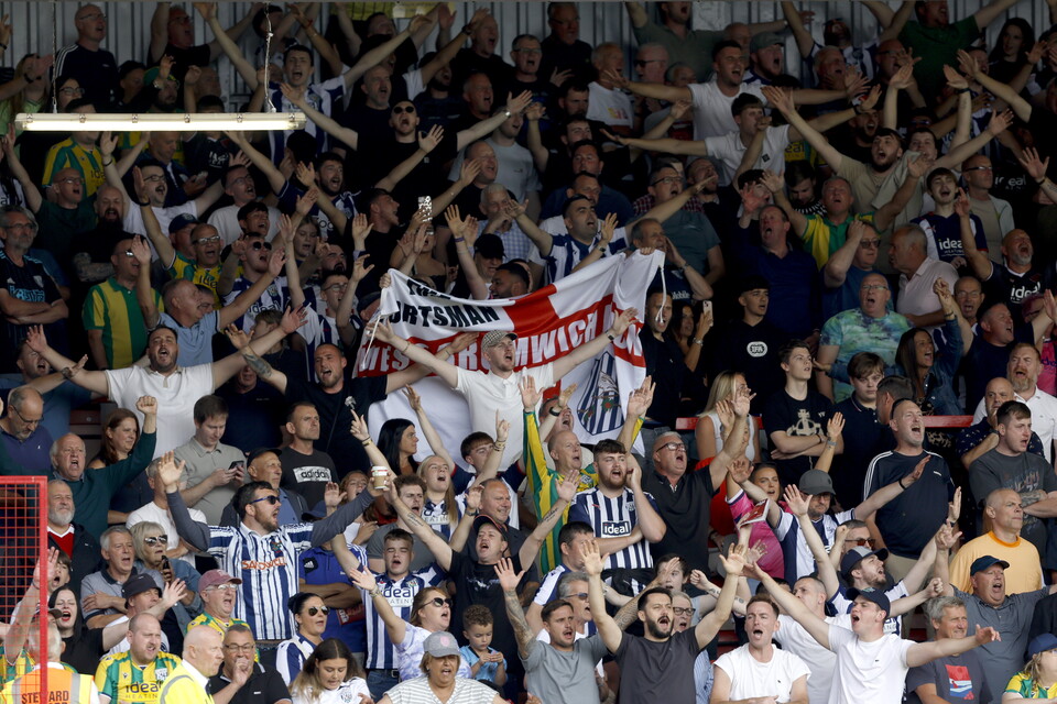 A general view of WBA fans cheering in a stand at a game