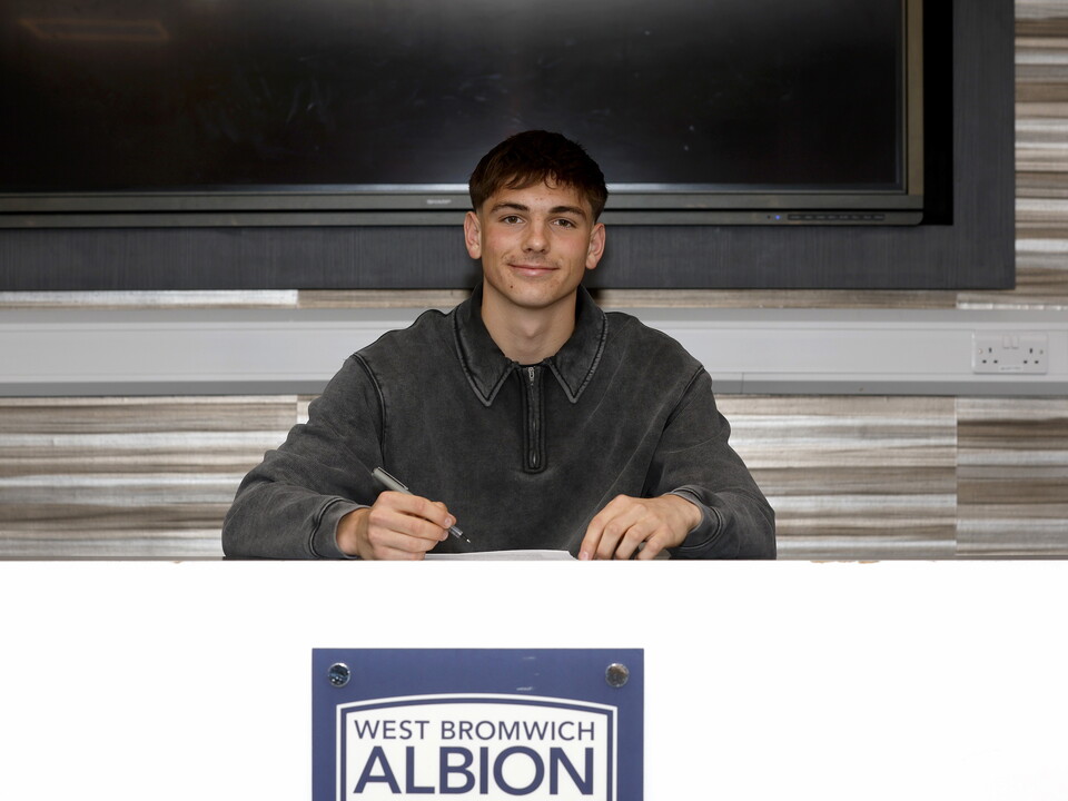 A photo of youngster Charlie Blackshields signing his first pro deal