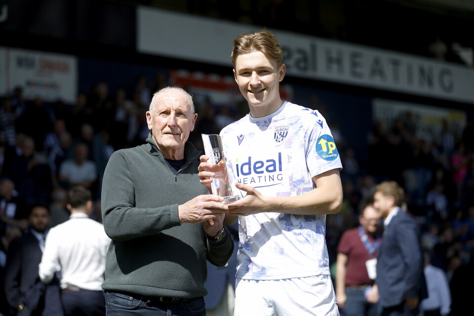 Ollie Bostock collects the Young Player of the Season award with Tony 'Bomber' Brown