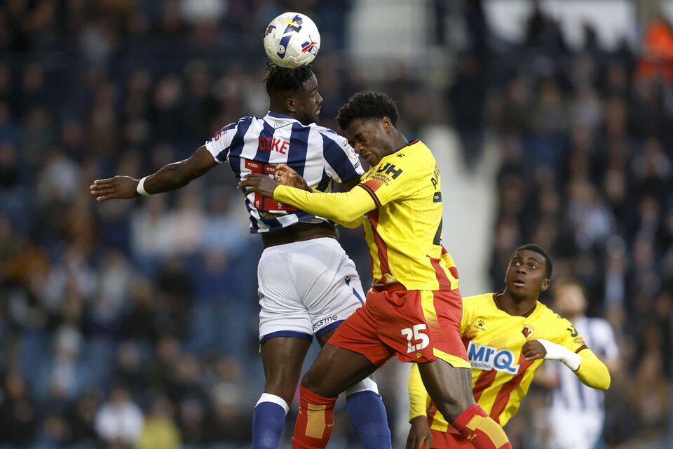 Daryl Dike heads the ball against Watford