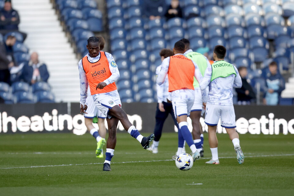 Ousmane Diakite warms up ahead of the Watford game