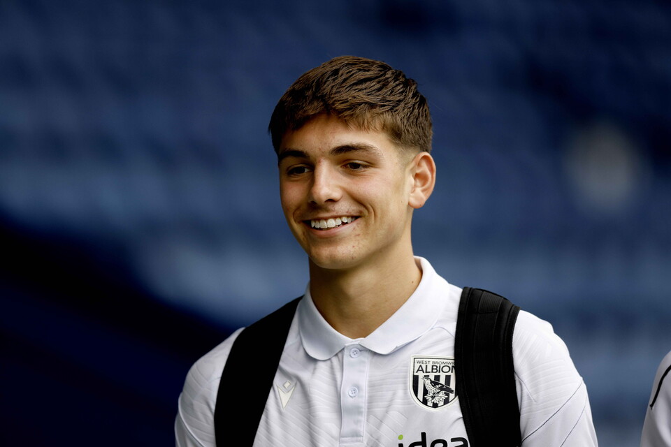 Charlie Blackshields smiling while arriving for a WBA game