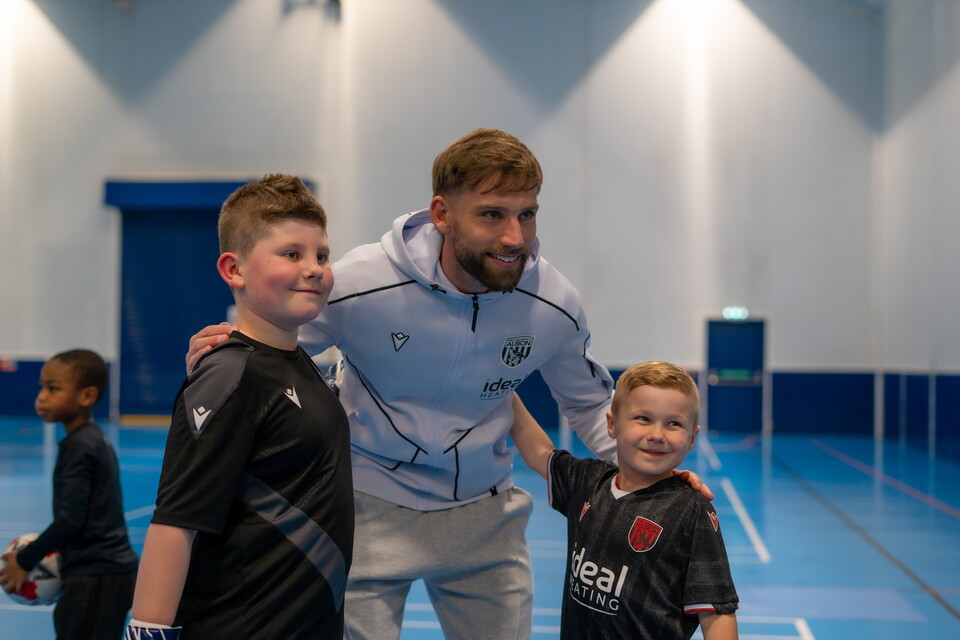 Charlie Taylor taking a photo with fans