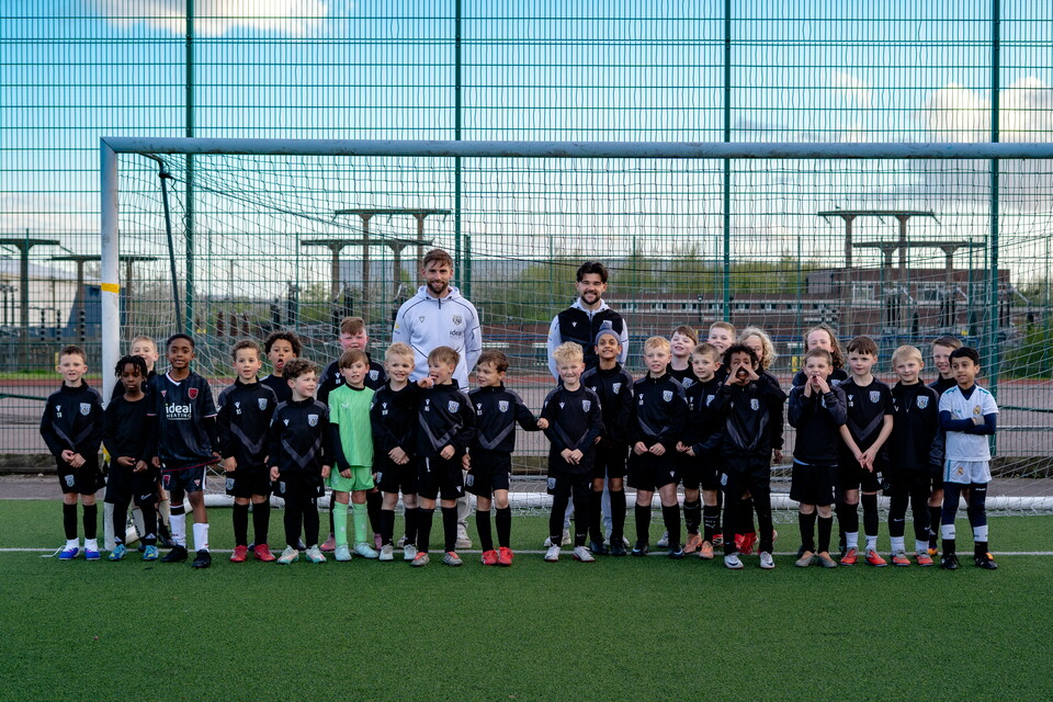 Alex Mowatt and Charlie Taylor in a group photo with a PDA Session