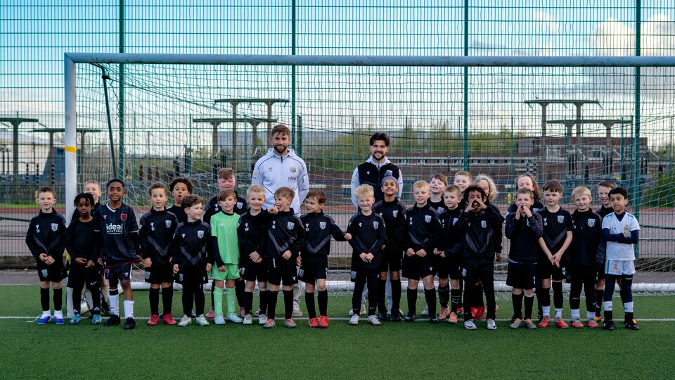 Mowatt & Taylor taking group photo with a PDA Football group