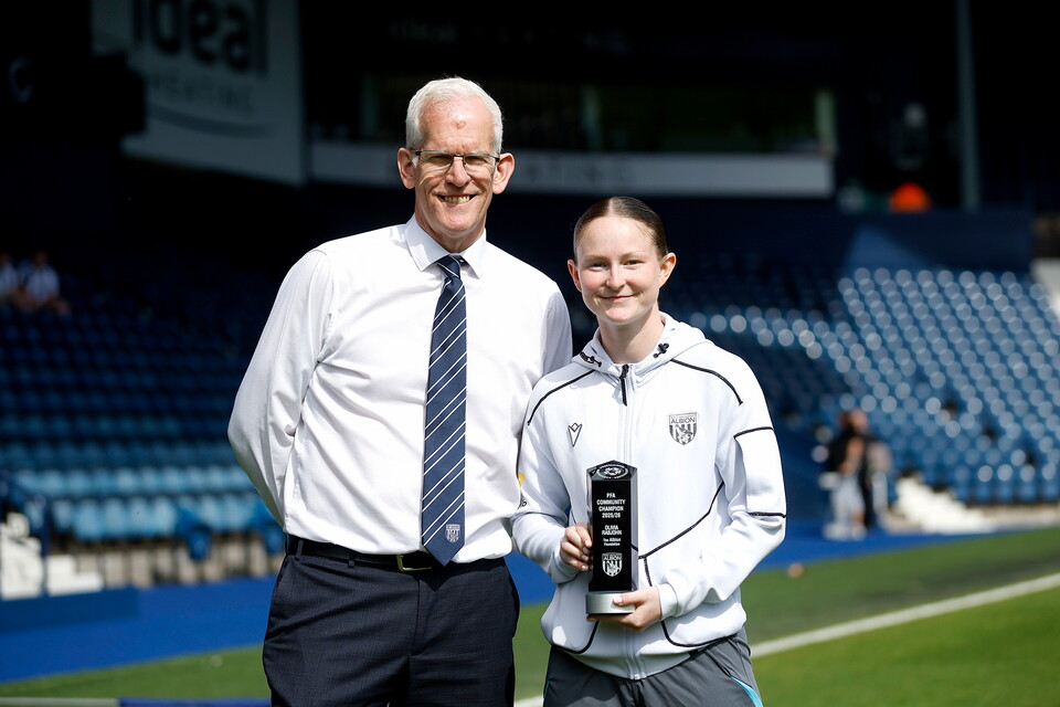 The Albion Foundation Director Rob Lake with Olivia Rabjohn holding their PFA Community Champion Award.