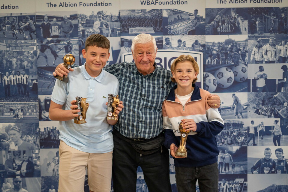 MJPL Players and a parent holding awards.