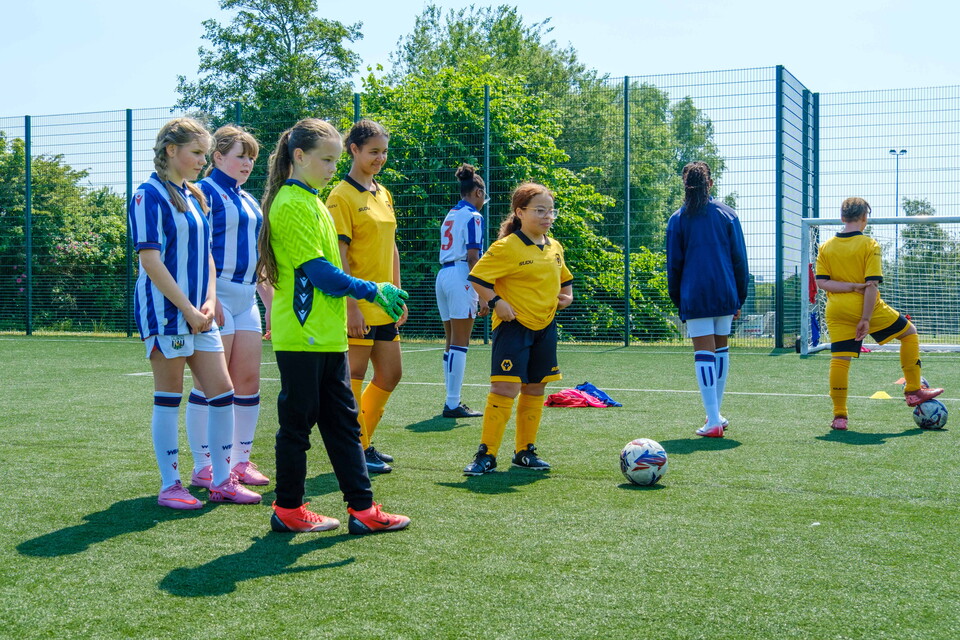 Wolves and Albion girls working together during a target practice drill