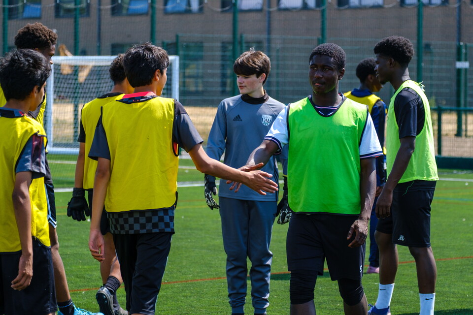 Players shaking hands after the game