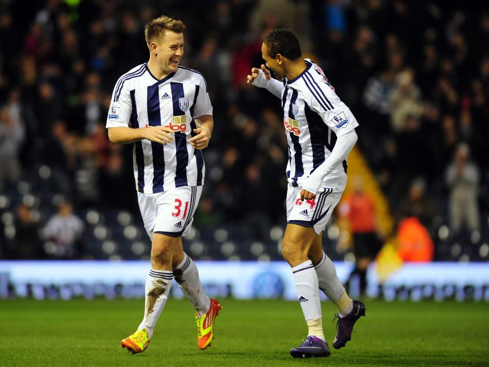 Simon Cox celebrates