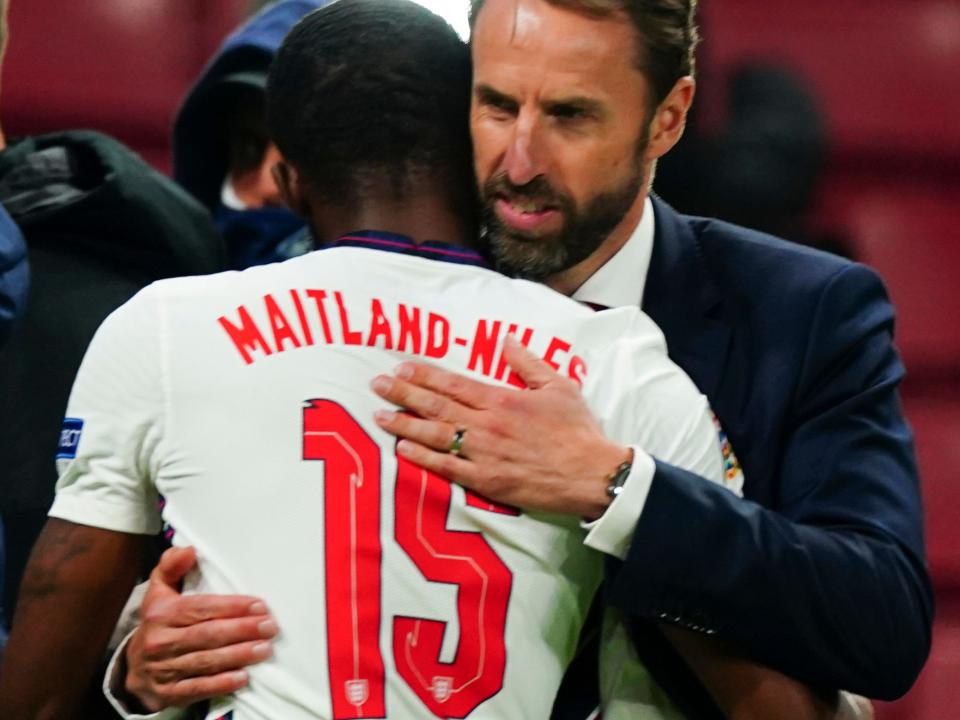Ainsley Maitland-Niles hugs England manager Gareth Southgate