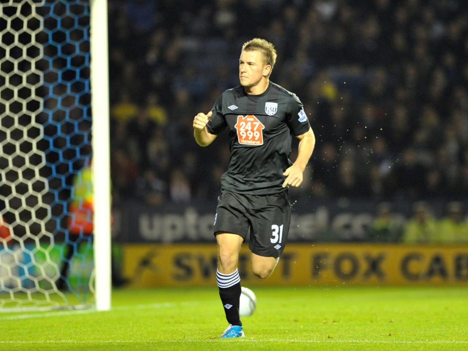 Simon Cox celebrates