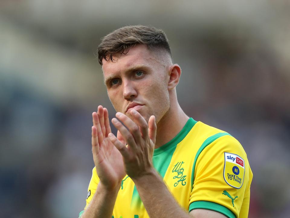 Dara O'Shea thanks the Albion supporters at Blackburn