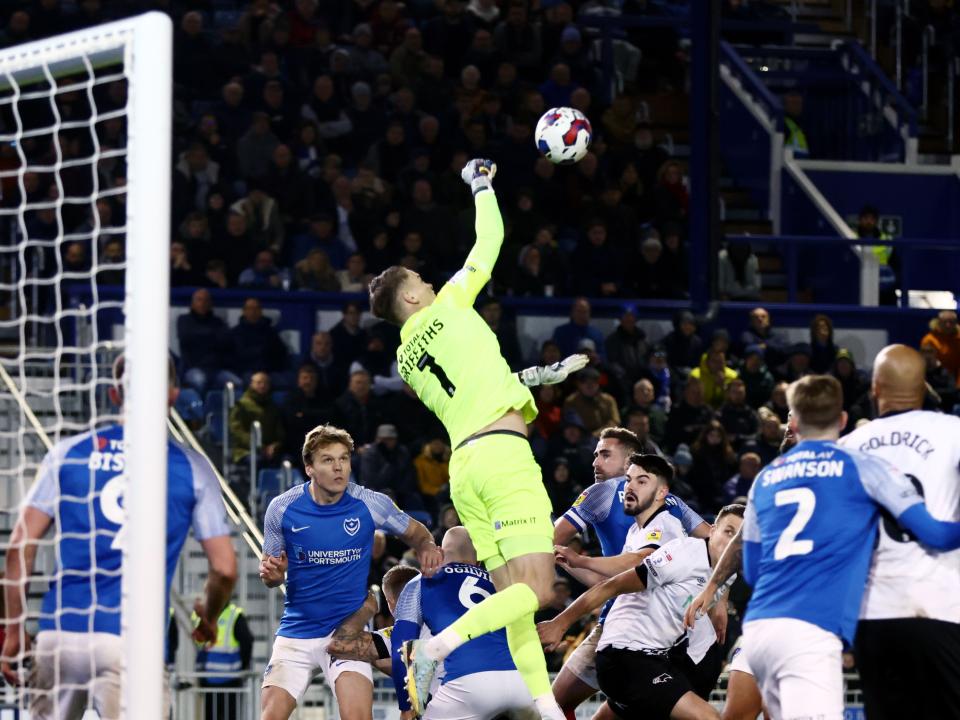 Josh Griffiths punches a ball clear