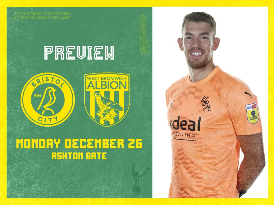 Alex Palmer stood next to the badges of Bristol City and Albion