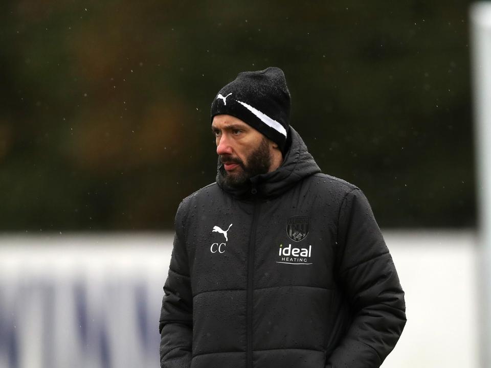 Carlos Corberán watches over training