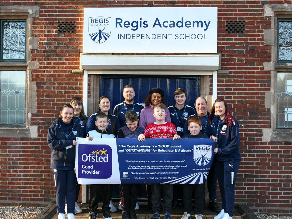 Julia Regis with staff and student outside The Regis Academy