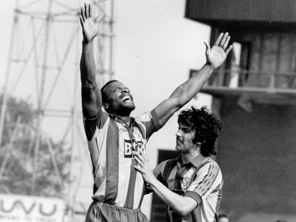 Cyrille Regis celebrates scoring a goal