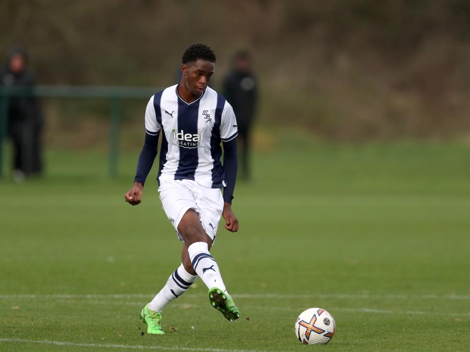 Kevin Mfuamba passes the ball during an U18s game at the training ground
