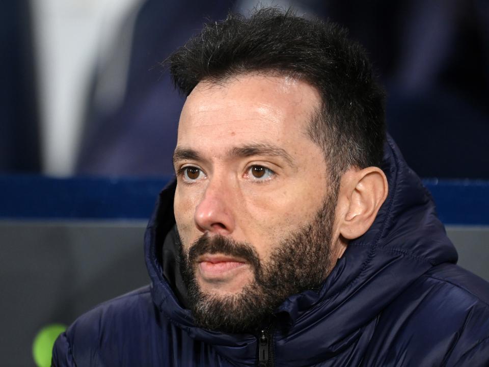 Carlos Corberán stares at the pitch from the sides