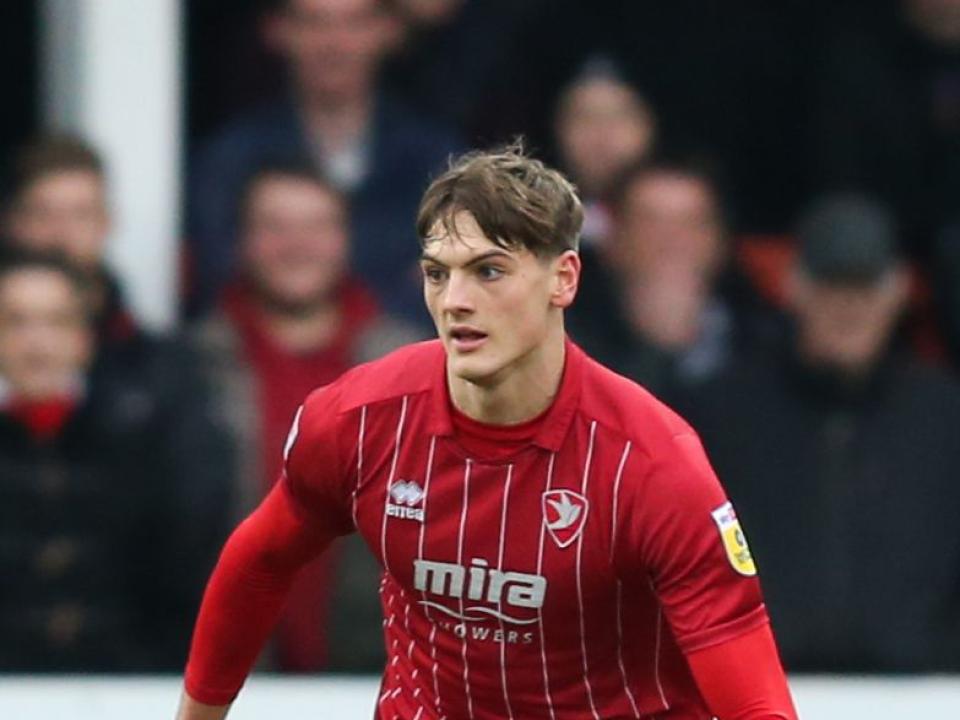 Caleb Taylor wearing a Cheltenham Town shirt