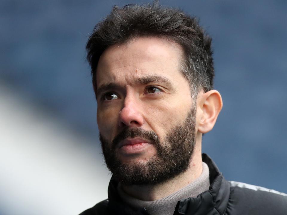 A close-up picture of Carlos Corberán's face