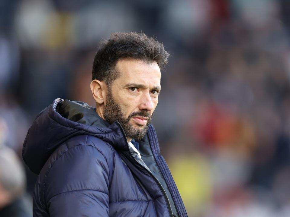 Carlos Corberán in a coat