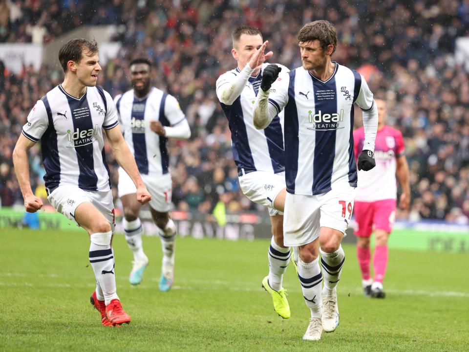 John Swift celebrates scoring against Huddersfield