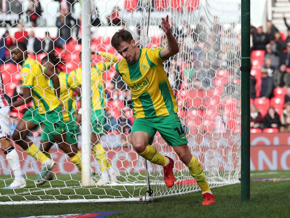 Jayson Molumby celebrates scoring against Stoke City