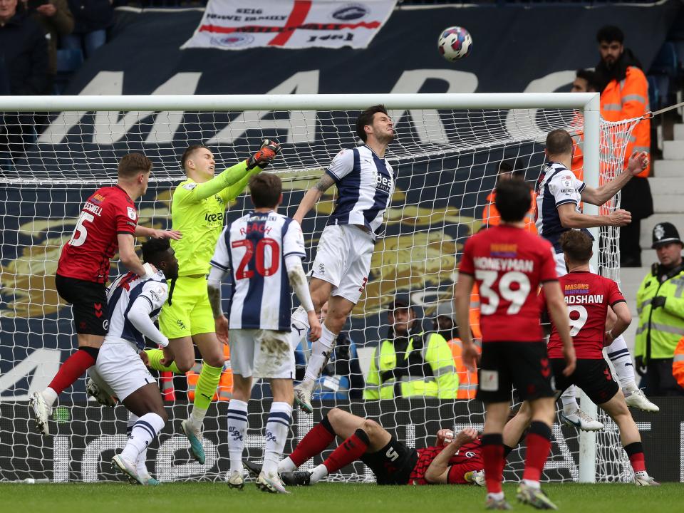 Okay Yokuslu heads the ball away from danger against Millwall