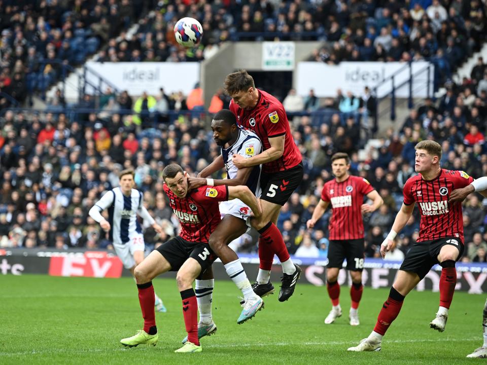An image of Semi Ajayi attempting to head the ball against Millwall defenders